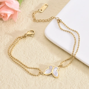 Elegant gold double-layered bead chain bracelet with a white shell butterfly pendant