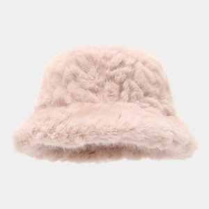 Detail of soft pink faux mink fur bucket hat with thick plush texture for winter warmth