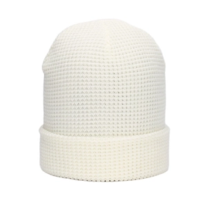 Close-up of thick beige waffle knit beanie showing texture and wide cuffed brim