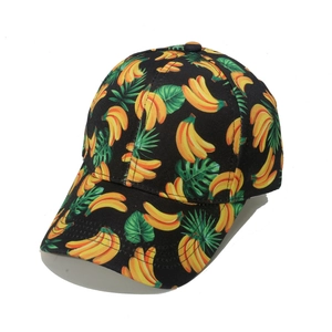 Women's black baseball cap with tropical green banana leaf and yellow fruit print pattern