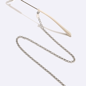 Minimalist silver round link eyeglass chain with non-slip silicone loops on white background