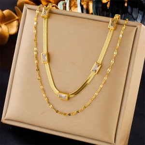 Double layered gold chain necklace featuring a snake chain with five rectangle zircons