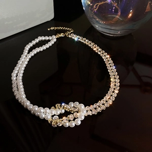 Minimalist pearl and rhinestone layered choker necklace with gold interwoven knot design