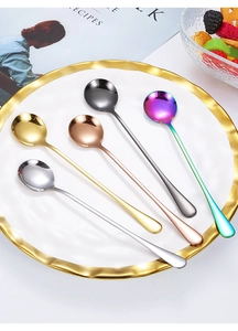Artistic layout of long-handled stainless steel dessert spoons in five vibrant colors