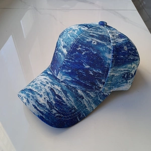 Detailed top view of the blue wave pattern baseball cap with a classic curved brim