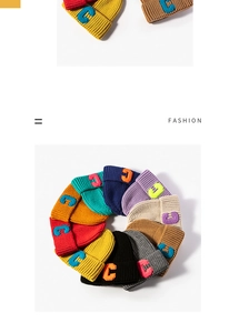 Detail of multi-color knitted beanies with embroidered C logo in a circular layout