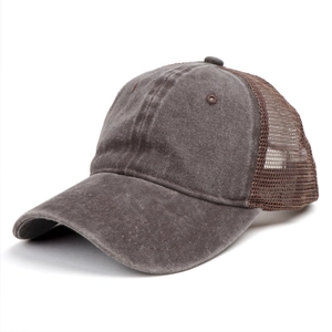 Close-up of vintage washed dark brown trucker hat showing breathable mesh and cotton fabric
