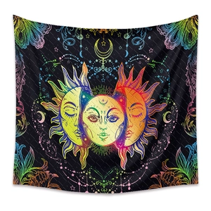 Detail of bohemian mandala tapestry featuring colorful sun moon and stars on black