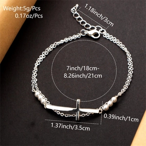 Detailed dimensions of silver cross and pearl layered bracelet with specific size labels