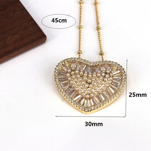 Elegant gold heart pendant necklace with pearls and rectangular rhinestones, 30mm width
