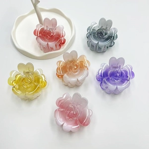 Detailed view of six colorful gradient flower hair claws made of premium acrylic material
