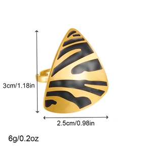 Detailed view of gold geometric ring with black zebra pattern and size specifications