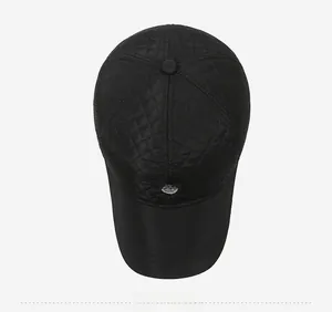 Top view of quilted baseball cap featuring diamond stitching and round fashion logo