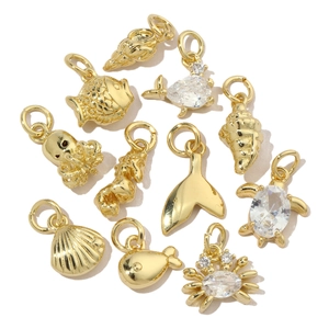 Golden sea creature pendants set with turtle octopus and shell designs for necklaces