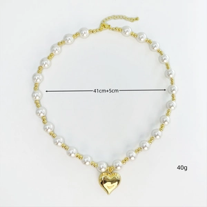 Detail of heart pendant pearl necklace with measurements 41cm plus 5cm extension