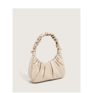 Beige pleated cloud crossbody bag with soft leather texture and golden metal hardware