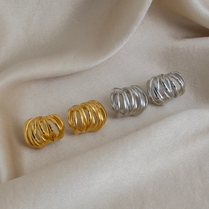 Modern C-shape multi-layer spiral earrings in gold and silver finish on silk fabric