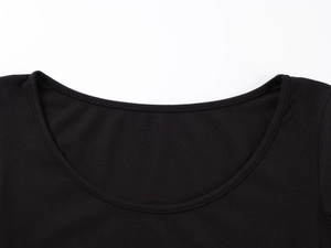 Detail shot of the U-neckline on a black long sleeve bodysuit with fine stitching