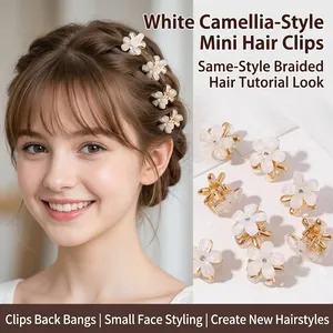 Detail view of mini camellia flower hair clips in white and gold for hairstyling