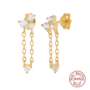 Macro shot of gold-plated 925 sterling silver tassel earrings with micro-set zircons