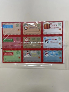 Detailed view of 9 unique Christmas gift labels with Santa, penguins, and To/From fields
