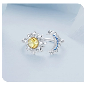 Detailed close-up of S925 sterling silver ring showing sun and moon gemstone engraving