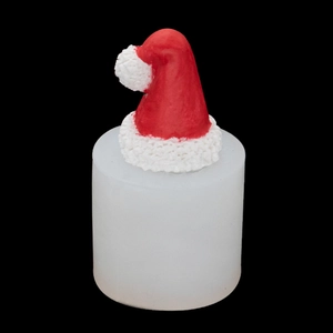 Macro shot of 3D Christmas hat silicone mold for DIY candles on black background