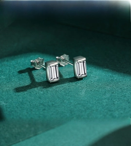 Detail of S925 sterling silver stud earrings with emerald-cut cubic zirconia gems