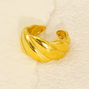 Macro view of a 18k gold plated stainless steel twisted croissant open ring