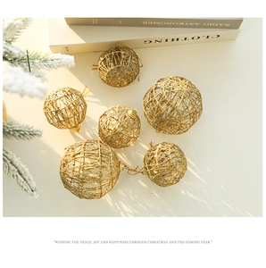 Detailed view of hollow gold glitter Christmas ornaments on a decorative festive background