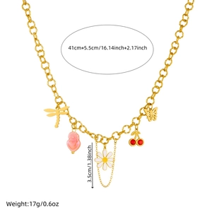 Gold-plated stainless steel necklace with daisy, dragonfly and cherry charms on white background