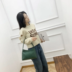 Green woven texture shoulder bag for women styled with a minimalist rectangular body