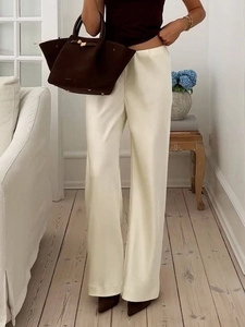 Elegant cream white satin high-waisted wide-leg trousers for a minimalist luxury style