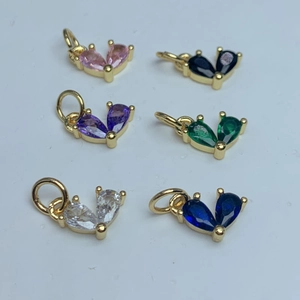 Gold-plated heart pendants with colorful zircon stones in a symmetrical grid display
