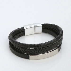 Detail of multi-layer braided leather bracelet with silver magnetic clasp and metal plate