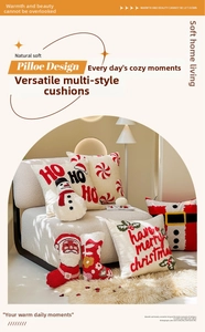 Close-up of tufted Christmas pillows with festive embroidery and cozy texture on a chair