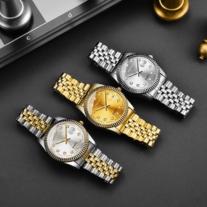 Business quartz calendar watches set in gold and silver finish on chessboard background