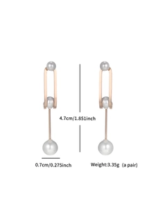 Detail view of rose gold drop earrings with grey pearls showing dimensions and 4.7cm height