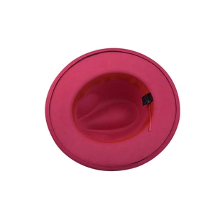 Detailed interior of rose red wool fedora with orange sweatband and washing label