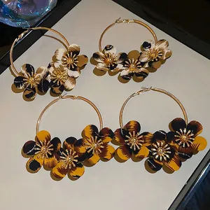 Retro hoop earrings set with leopard print fabric flowers and golden metal finish