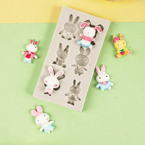 Detail of 6-cavity grey silicone rabbit mold with various bunny shapes for 3D desserts