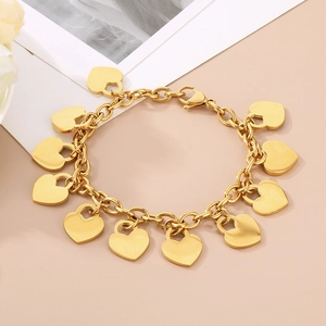 Detail of 18K gold plated stainless steel chain bracelet with heart charms and lobster clasp