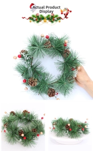 Close-up of PVC pine needles, natural cones, and red holly berries on Christmas wreath