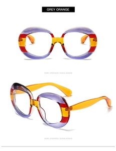 Macro detail of oversized round sunglasses with purple and orange stripe pattern