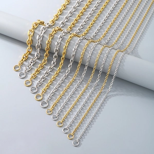 Close-up of gold and silver stainless steel O-chains with toggle clasp details