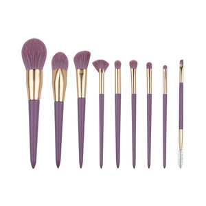 9-piece professional makeup brush set featuring purple gradient bristles and gold ferrules