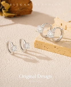 Détail de boucles d'oreilles créoles en argent S925 avec pierres de moissanite brillantes