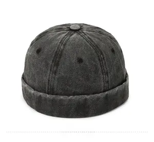 Macro detail of dark grey washed denim miki hat showing crown panels and metal eyelets