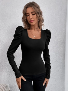 Detail of square neck and puff sleeve on slim fit black knitted long sleeve top