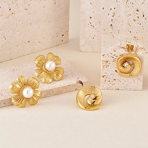 Minimalist gold stainless steel earrings with spiral texture, pearl flower, and crystals